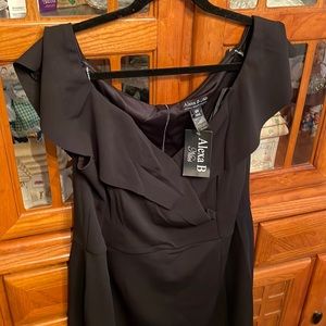 Womens Blk dress new with tags , cross cross in front , cap sleeve, bott slit
